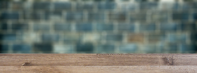 blank wooden table. Flooring. Texture of dark brickwork. Close-up. Building background.