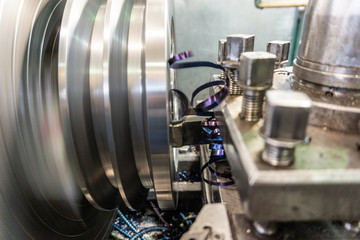 Processing of metal on the machine. Turning work in production.