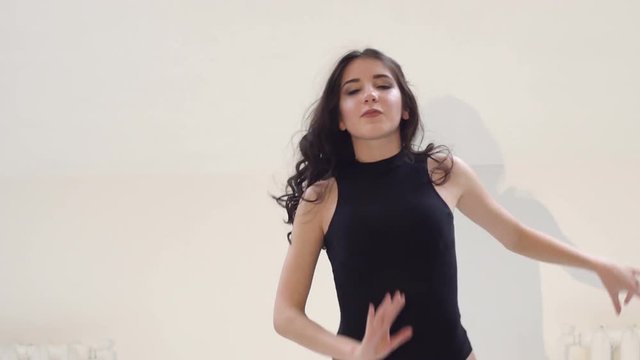 Sensual dancing girl ballroom dancing with a dance Studio on a white background