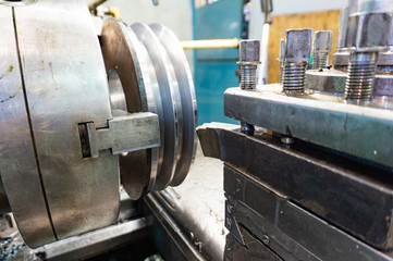 Processing of metal on the machine. Turning work in production.