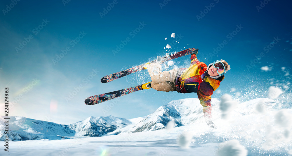 Wall mural Skiing. Jumping skier. Extreme winter sports.