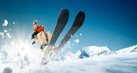 Skiing. Jumping skier. Extreme winter sports. - obrazy, fototapety, plakaty