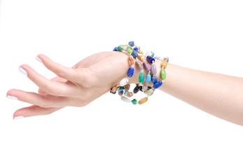 Beads colorful stones bracelet in hand on a white background isolation