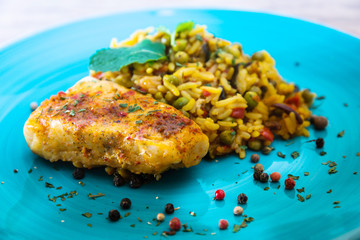 Andalusian fish, saffron rice with vegetables