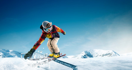 Naklejka na ściany i meble Skiing. Jumping skier. Extreme winter sports.