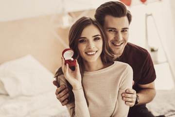 Future wife. Future wife feeling satisfied while showing her luxurious engagement ring to her...