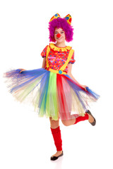 Happy young clown girl on white background