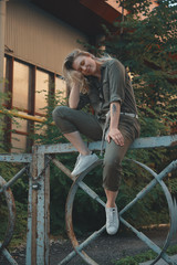 Outdoor lifestyle portrait of carefree urban girl