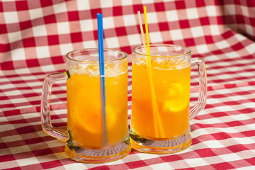 Beer with lemon in glass glasses close-up.