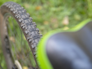 Knobby winter tire with spikes on a mountain bike close-up