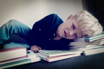 young boy cry tired of doing homework, overload, stress
