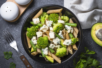 Whole-grain pasta penne with broccoli, avocado, green beans, pea