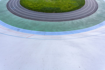 Track and field concept. High angle top view cropped photo of new empty modern public bicycle asphalt track in the open air with colored paths for practice, playing sports