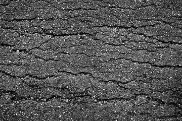 crack and texture of asphalt road - top view background.