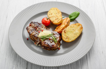 Useful and tasty food, grilled beefsteak with french fries