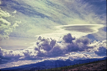 Clouds streak across a blue sky