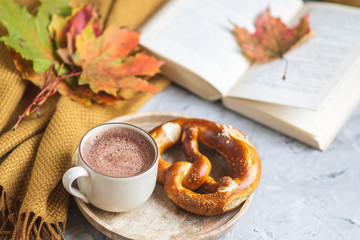 Tea Cup Hot Chocolate Coffee Autumn Time Bakery Pretzel Toned Photo Knitting Scarf Blanket Yellow Leaves Gray Background