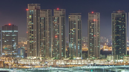 Buildings on Al Reem island in Abu Dhabi night timelapse from above.