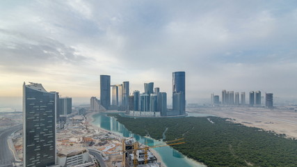 Obraz premium Buildings on Al Reem island in Abu Dhabi timelapse from above.