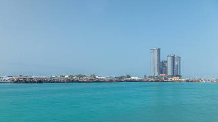 Fototapeta premium Traditional wooden fishing dhows berthed in the Dhow Harbour in Abu Dhabi timelapse