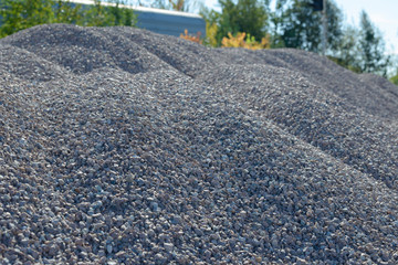 Breakstone background. Road gravel. Gravel texture. Crushed Gravel background. Piles of limestone rocks. Break stones on construction site.