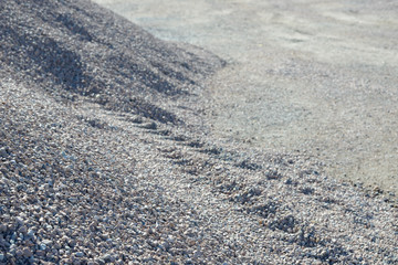 Breakstone background. Road gravel. Gravel texture. Crushed Gravel background. Piles of limestone rocks. Break stones on construction site.