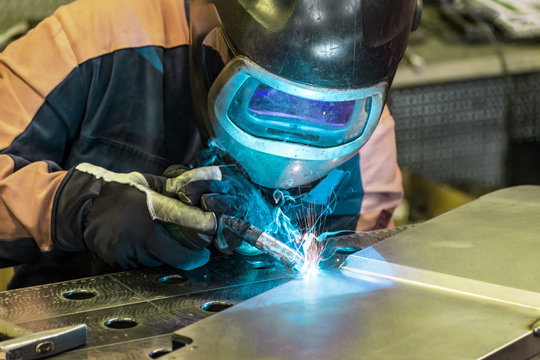 Metal welding process that uses a non-consumable tungsten electrode. Close-up.