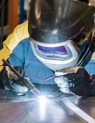 Metal welding process that uses a non-consumable tungsten electrode. Close-up.