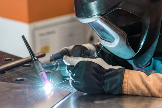 Metal welding process that uses a non-consumable tungsten electrode. Close-up.