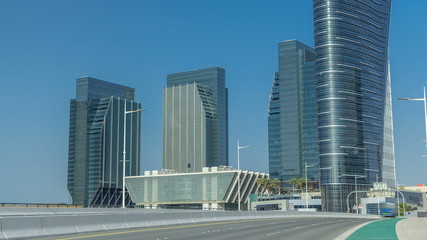 Modern buildings in Abu Dhabi skyline timelapse with waterfront.