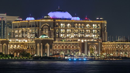 Fototapeta na wymiar Emirates Palace illuminated at night timelapse, Abu Dhabi, United Arab Emirates
