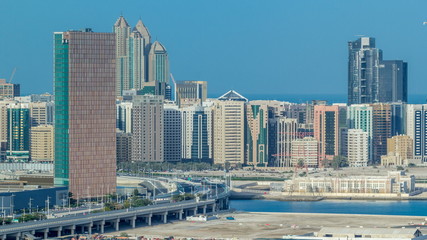 Fototapeta na wymiar Buildings on Al Reem island in Abu Dhabi timelapse from above.