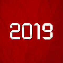 Origami 2019 symbol on a crumpled paper red background.