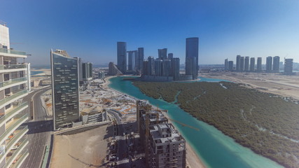 Buildings on Al Reem island in Abu Dhabi timelapse from above.