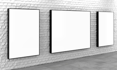 Blank light boxes on white brick wall