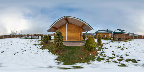 full seamless panorama 360 degrees angle view near small wooden vacation house in the winter cloudy...