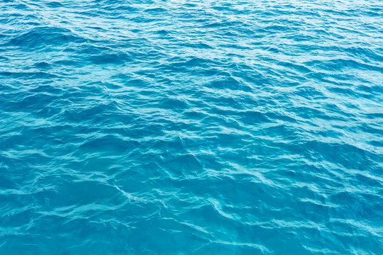 surface blue sea water. Texture of water with small waves.