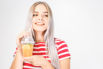 Health, people, food, sports, lifestyle and beauty content - Smiling Young Woman with glass of Water with lemon