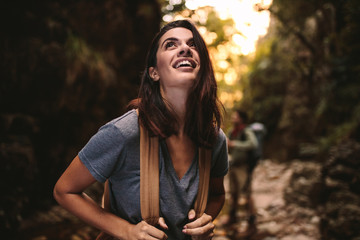 Beautiful woman enjoying hiking in nature