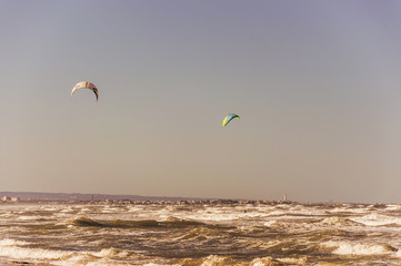 Kitesurfing on the sandy and windy beaches of Ostuni in Salento on the Adriatic sea