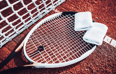 Tennis racket on the tennis court. Sport, recreation concept