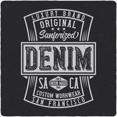 Denim vintage label logo with lettering composition on dark background.