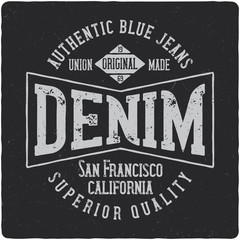 Denim vintage label logo with lettering composition on dark background.