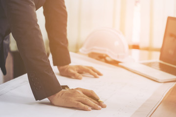 Obraz premium Architects of hands sketching a housing project in office.selective focus