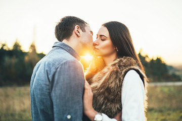 Happy couple in love relaxing in the field.