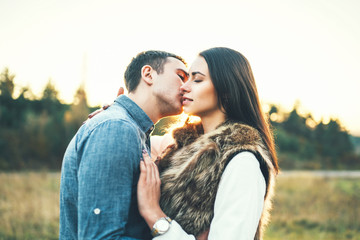 Happy couple in love relaxing in the field.