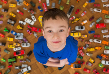 Boy with his toy car collection
