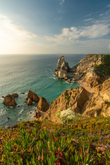 The beautiful Praia da Ursa beach on Portugal's wild Atlantic coast seen from above