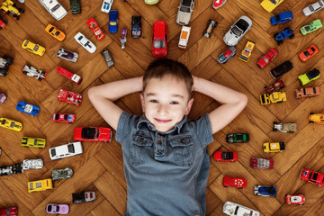 Boy with his toy car collection
