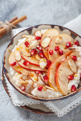 Coconut rice with pomegranate, pear and almond slices